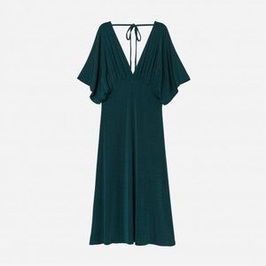 Flattering green dress. Beautiful flows material